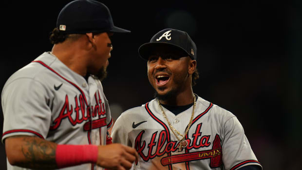 Jul 25, 2023; Boston, Massachusetts, USA; Atlanta Braves second baseman Ozzie Albies (1) (right) reacts with shortstop Orlando Arcia (11) after a triple play against the Boston Red Sox in the third inning at Fenway Park.